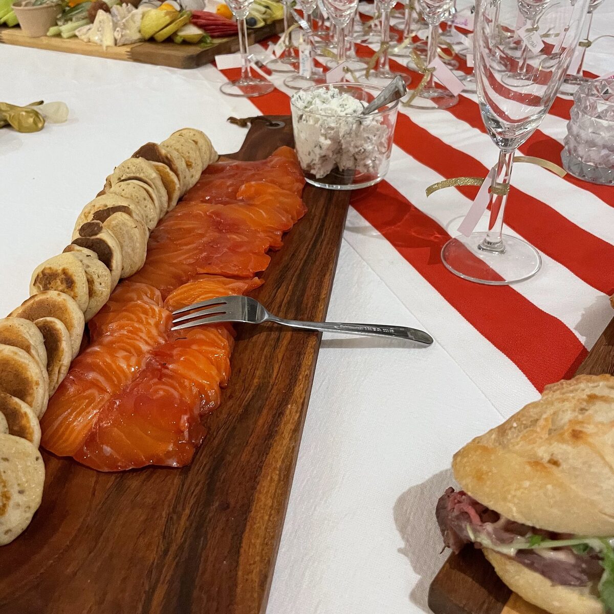 Salmon blinis plated by COMER for a corporate cocktail reception
